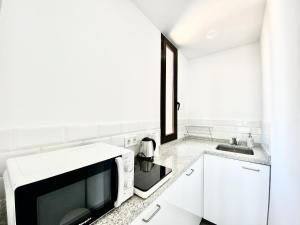 Kuchyňa alebo kuchynka v ubytovaní Las Palmeras - Best Location Cozy Apartment