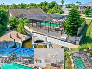an aerial view of a house with a swimming pool at Bahama Haven Saltwater Canal Pool Home w dock and boat lift in Palm Coast