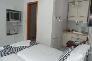 Postel nebo postele na pokoji v ubytování Room Leon