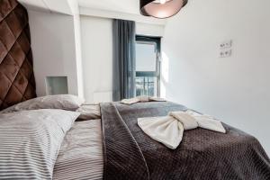 Postel nebo postele na pokoji v ubytování Fancy Sunset Gardenia Dziwnów