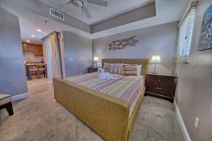 a bedroom with a bed with a dog laying on it at PierPark Cozy Condo w View Sterling Breeze Resorts in Panama City Beach