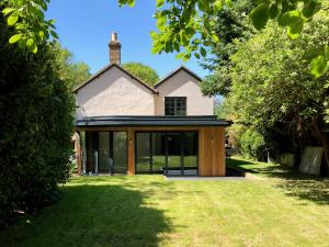 an extension to a house with glass doors at The Old Red Lion in Ely