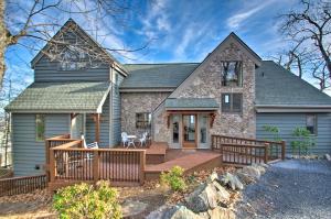a home with a wooden deck and a house at Wintergreen Resort Villa Less Than 2 Mi to Ski Slopes in Lyndhurst