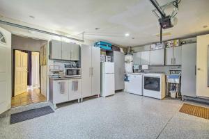 a kitchen with white appliances in a room at Westminster Studio with Patio Less Than 9 Mi to Beach! in Westminster