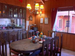 Kuchyň nebo kuchyňský kout v ubytování Hostal el Nogal Pucón