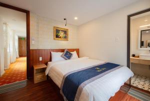 Postel nebo postele na pokoji v ubytování Hotel Bao Duy