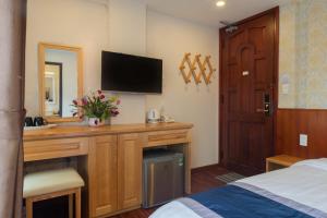 Postel nebo postele na pokoji v ubytování Hotel Bao Duy