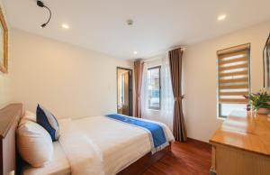 Postel nebo postele na pokoji v ubytování Hotel Bao Duy