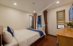 Postel nebo postele na pokoji v ubytování Hotel Bao Duy