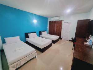 Letto o letti in una camera di Chat House Soi 18 Mithuna Chiangrai