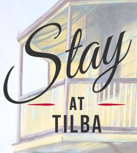 a sign that reads stay at tiliba in front of a window at Stay at Tilba in Central Tilba