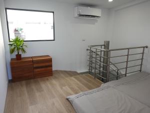 מיטה או מיטות בחדר ב-Summerflow Hostel