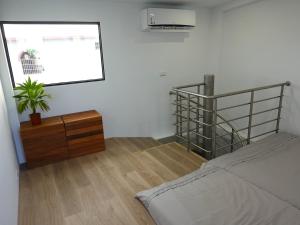 מיטה או מיטות בחדר ב-Summerflow Hostel