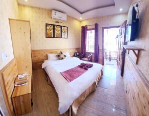 Postel nebo postele na pokoji v ubytování Dang Khoa Garden Inn Homestay