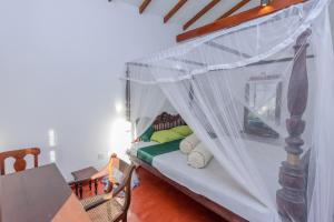 Villa Guru Hikkaduwa客房内的一张或多张床位
