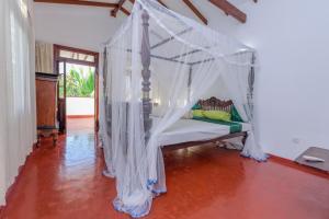 Villa Guru Hikkaduwa客房内的一张或多张床位