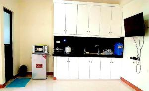 A kitchen or kitchenette at MS Residence Building