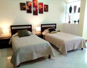 A bed or beds in a room at MS Residence Building