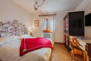 Postel nebo postele na pokoji v ubytování Hotel Panda Cortina- ricarica auto elettriche