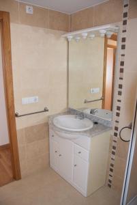 a bathroom with a sink and a mirror at Apartamento en Alcora (Castellón) in Alcora