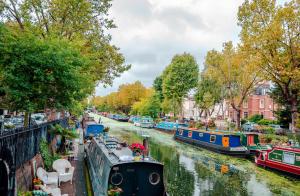a group of boats are docked on a river at Westpoint Hotel in London