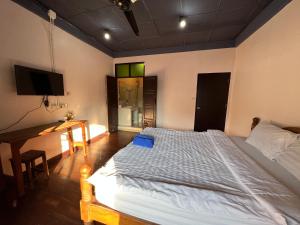 Postel nebo postele na pokoji v ubytování Madera House Chiang Mai