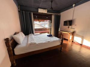 Postel nebo postele na pokoji v ubytování Madera House Chiang Mai