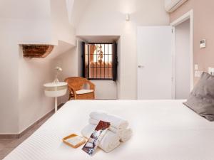 Posteľ alebo postele v izbe v ubytovaní Apartamentos Plaza Mayor 35