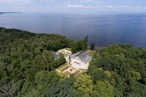 an aerial view of a large house in the trees at Manowce Palace in Trzebieradz