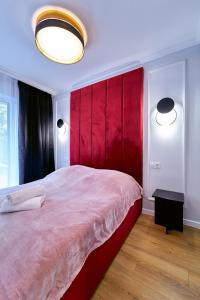 Posteľ alebo postele v izbe v ubytovaní LAGUNA Apartament Polanica Residence 6 z garażem SPA + 32 fotografií