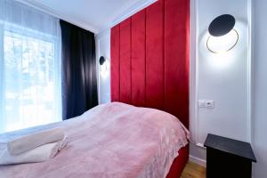 Posteľ alebo postele v izbe v ubytovaní LAGUNA Apartament Polanica Residence 6 z garażem SPA