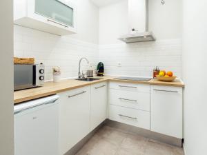 Kuchyňa alebo kuchynka v ubytovaní Apartamentos Plaza Mayor 35