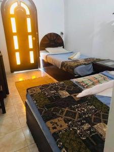 Letto o letti in una camera di Lagona Dahab Hotel