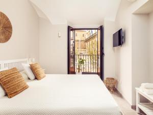 Posteľ alebo postele v izbe v ubytovaní Apartamentos Plaza Mayor 35
