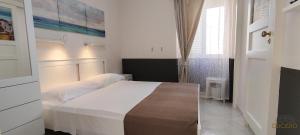 A bed or beds in a room at DUCEZIO rooms