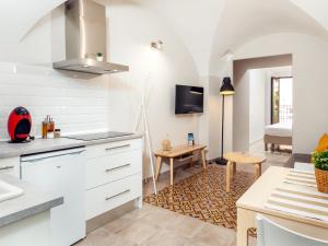 Kuchyňa alebo kuchynka v ubytovaní Apartamentos Plaza Mayor 35