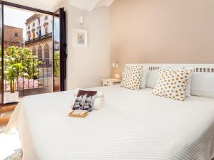 Posteľ alebo postele v izbe v ubytovaní Apartamentos Plaza Mayor 35