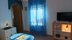 A television and/or entertainment centre at El Duende del Tejar Még 37 kép