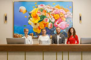 a group of people standing at a podium at 1 ART HOTEL in Moscow