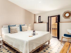 Posteľ alebo postele v izbe v ubytovaní Apartamentos Plaza Mayor 35