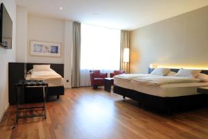 Katil atau katil-katil dalam bilik di Hotel Banana City Winterthur