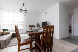 Televízia a/alebo spoločenská miestnosť v ubytovaní Symphony Modern Tower Apartamenty