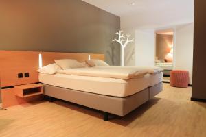 Katil atau katil-katil dalam bilik di Hotel Banana City Winterthur