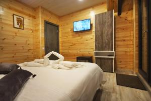 Un pat sau paturi într-o cameră la KubiA