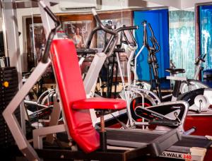 a gym with several bikes and a treadmill at Best Western Jangwani Sea Breeze Resort in Dar es Salaam