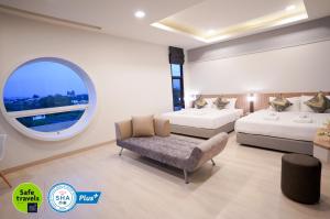 Voodi või voodid majutusasutuse The Space Hotel Chiang Rai toas