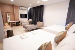 Voodi või voodid majutusasutuse The Space Hotel Chiang Rai toas