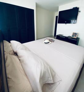 Een bed of bedden in een kamer bij Apartamento Rodadero