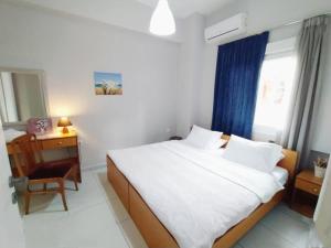 Łóżko lub łóżka w pokoju w obiekcie Heraklion Old Port Apartments