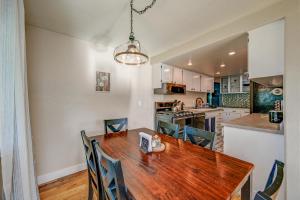 a kitchen and dining room with a wooden table and chairs at Renton Oasis- Relaxing 3BR Home with Great Outdoor! home in Renton